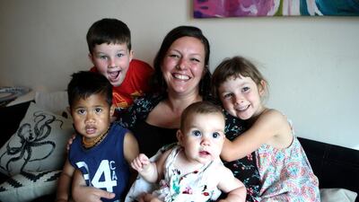 Brooke Bauer, 36, an infant-feeding specialist, spent 10 days at a migrant camp in Greece. While she took her youngest daughter, six-month-old Fiadh, with her, her other children, from left, August, 4, Donnacha, 4, and Lilia, 5 stayed in Abu Dhabi. Ravindranath K / The National
