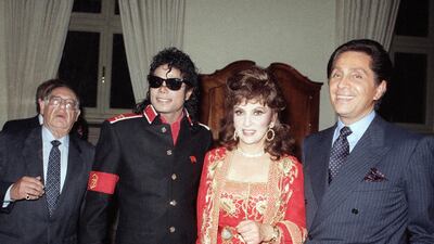 From left, Michael Jackson, Lollobrigida and fashion designer Valentino in 1988. AP
