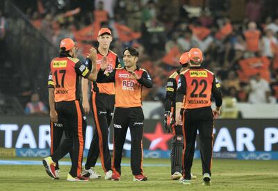 Rashid Khan, centre, delivered 18 dot balls to equal an IPL record for a spinner and help Sunrisers Hyderabad to victory over Mumbai Indian. Noah Seelam / AFP