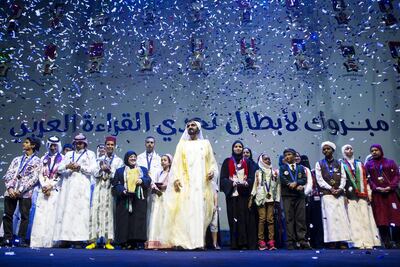 Sheikh Mohammed bin Rashid, Vice President and Ruler of Dubai, stands with the finalists of the Arab Reading Challenge during the closing awards ceremony at the Dubai Opera last year. Christopher Pike / The National