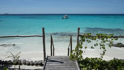 The crystal clear turquoise water along the coral beach of the resort on Panasesa Island in the Conflict Group of Islands of the Mine Bay Provence, Papua New Guinea. Photo: Antonie Robertson / The National