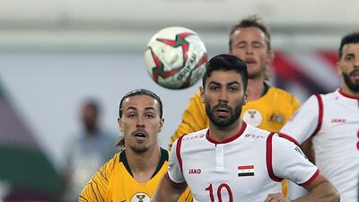 Osman, right, duels for the ball with Irvine. AP Photo