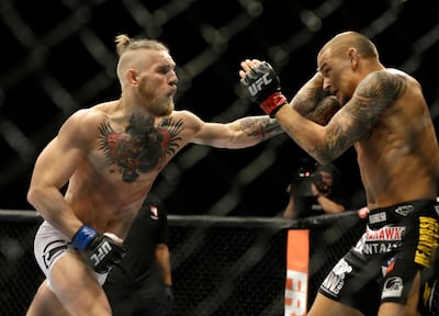 Conor McGregor, left, beat Dustin Poirier in their first fight in September 2014. AP