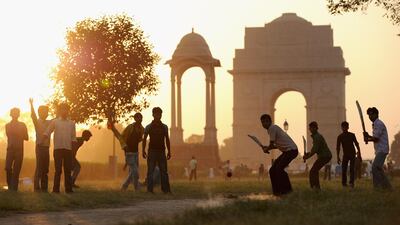 Children play cricket in India Gate Park in Delhi, India. Gareth Copley / Getty Images