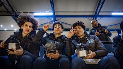 Three U-18 members of the Queen Park Rangers enjoy the iftar meal