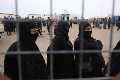 Iraqis wait to get personal Identification cards and birth certificates for their children who were born under the rule of ISIS. EPA