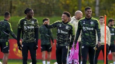 Manchester United's Aaron Wan-Bissaka, Jadon Sancho and Marcus Rashford during a training session in Carrington. PA