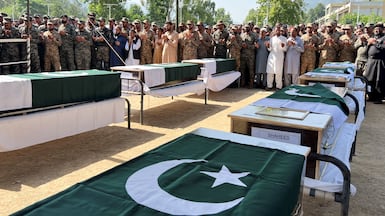 Pakistani army officers and fellow mourners offer prayers at the funeral of the victims of an Mi-17 military helicopter crash, in Muzaffarabad, Kashmir. Reuters