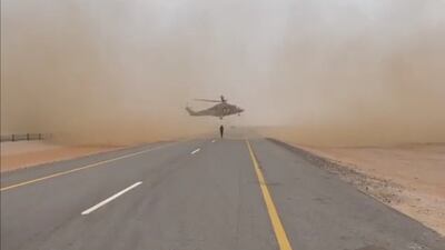 A helicopter lands on an empty stretch of motorway between the towns of Adam and Haima to collect a critically injured person. Photo: Royal Oman Police