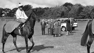 Charles Haughey, background left, at Ballydoyle Stables, Tipperary, in 1987. Getty