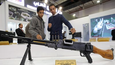 A visitor shows a GPMG at the Egyptian stand during the last day of Egypt Defence Expo, showcasing military systems and hardware, in Cairo, Egypt. Reuters