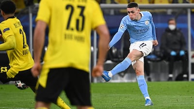 Manchester City midfielder Foden scores the second goal during the Champions League quarter-final second leg at Borussia Dortmund. AFP