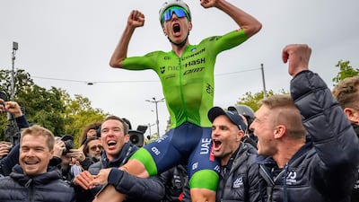 Slovenia's Tadej Pogacar celebrates with his team after winning the men's Elite Road Race. AFP