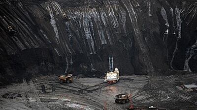A large excavator loads a lorry with oil sands at the Shell Albian mine near Fort McMurray in Alberta, Canada. At an estimated 175 billion barrels, Alberta's oil sands are the second largest oil reserve in the world behind Saudi Arabia, but they were neglected for years, except by local companies, because of high extraction costs.