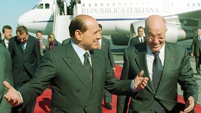 Mr Berlusconi is welcomed by former Tunisian presidential adviser Abdelaziz Ben Dhia, right, in Tunis in November 2001. It was his first official visit to a Muslim country after he said the West 'should be confident of the superiority of our civilization'. AFP