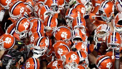 The Clemson Tigers huddle before taking on the Alabama Crimson Tide in the 2016 College Football Playoff National Championship Game at University of Phoenix Stadium on January 11, 2016 in Glendale, Arizona. Norm Hall/Getty Images/AFP