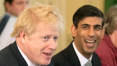 With Mr Johnson at his first Cabinet meeting after a reshuffle at 10 Downing Street in February 2020. Getty Images