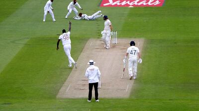 West Indies' captain Jason Holder celebrates taking the wicket of England batsman Jos Buttler. AP