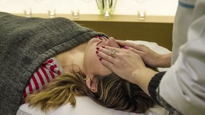 Reiki, a treatment based on the exchange of energies, is provided by therapists at The DNA Center for Integrative Medicine & Wellness on Saadiyat Island. Mona Al-Marzooqi / The National