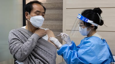 A nurse administers a dose of the AstraZeneca Covid-19 vaccine at the Nowon District public health centre in Seoul, South Korea. The country resumed inoculations with the AstraZeneca shot this week after a suspension, but will limit use to those between 30 and 60 years old. Bloomberg
