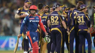 Kolkata Knight Riders cricketers celebrate the wicket of Delhi Daredevils batsman Quinton de Kock. AFP / Dibyangshu SARKAR