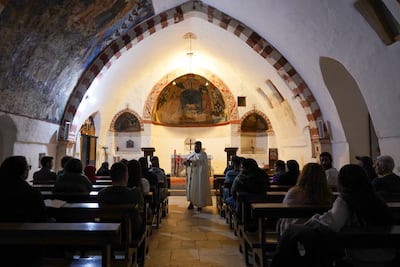 Father Hani Tawk celebrates Mass at the Deir Qannoubine monastery on Maundy Thursday. Photo: Finbar Anderson / The National