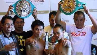 Dubai, United Arab Emirates- June, 27, 2013: (L) Philippines Boxer Denver Cuello and (R) Chinese Boxer Xiong Zhao Zhong pose during the official Weigh-In in Dubai. ( Satish Kumar / The National ) For Sports