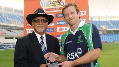 Ireland's Ed Joyce, right, is presented with the player of the match award by match referee, Dev Govindjee for his superb innings against Scotland.