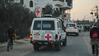 Red Cross vehicles carrying the bodies of two people believed to be deceased hostages handed over by Hamas make their way toward the Kissufim border crossing with Israel, to be transferred to Israeli authorities, in Deir al-Balah, central Gaza Strip, Thursday, Oct. 30, 2025. (AP Photo / Abdel Kareem Hana)