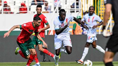 Morocco's defender Achraf Hakimi, left, fights for the ball with DR Congo's forward Silas. AFP