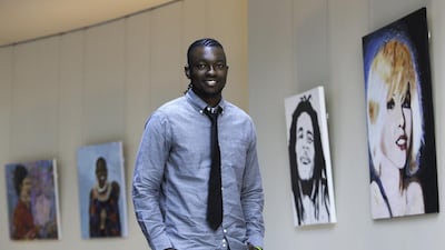 Artist Victor Sitali poses with his artworks. Photo: Victor Sitali