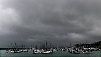 Dark clouds approach over boats at Airlie Beach in Queensland, Australia on March 27, 2017. Cyclone Debbie, expected to be upgraded to a category 4 storm, is due to hit Queensland’s far north coast early Tuesday. Dan Peled / EPA