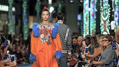 Models walk up and down the catwalk during the Dolce & Gabbana Fashion Show at Dubai Mall.