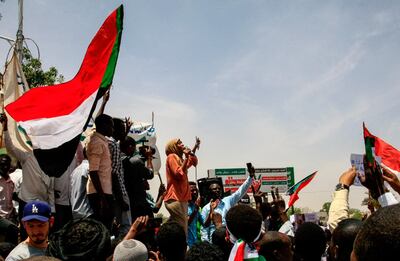 Sudanese protesters chant slogansoutside the army complex in Sudan's capital Khartoum. Ebrahim Hamid / AFP