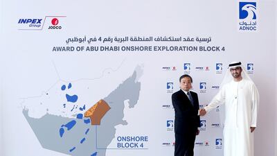 Mr Ueda, left at the signing ceremony with Dr Al Jaber. The Japanese firm won a 35-year exploration rights to the block, which straddles Abu Dhabi’s border with Dubai. Courtsey: Adnoc