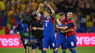Slovakia players celebrate after their 1-1 draw with Romania at Frankfurt Arena that sealed their place in the Euro 2024 last 16. Getty Images