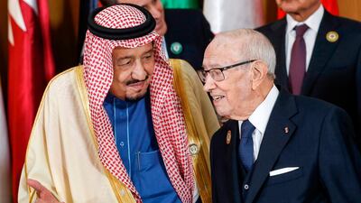 Saudi Arabia's King Salman bin Abdulaziz (left) speaks with Tunisian President Beji Caid Essebsi during the group photo with other Arab leaders during the 30th Arab League summit in the Tunisian capital Tunis. AFP