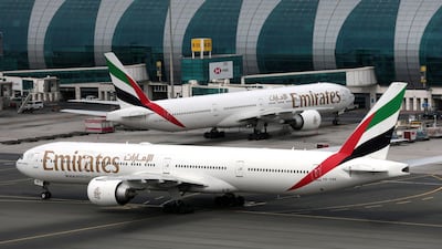 FILE PHOTO: Emirates Airline Boeing 777-300ER planes are seen at Dubai International Airport in Dubai, United Arab Emirates February 15, 2019. REUTERS/Christopher Pike/File Photo
