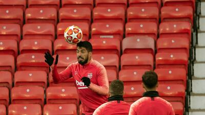 Barcelona's Luis Suarez, left, during the training session at Old Trafford, Manchester. AP