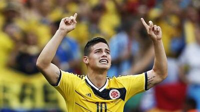 Colombia's midfielder James Rodriguez celebrates after scoring a goal during the Group C football match between Colombia and Ivory Coast at the Mane Garrincha National Stadium in Brasilia. Rodriguez finished with six goals at the World Cup. AFP PHOTO / ADRIAN DENNIS