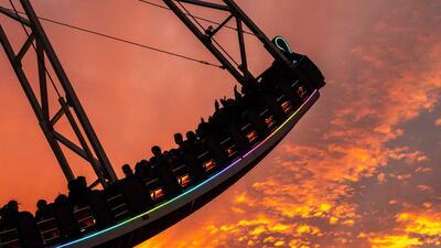 People ride on a pirate ship amusement ride at the Tokyo Dome City in the Bunkyo district of Tokyo. AFP