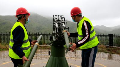 Workers at a meteorology bureau fire a cloud-seeding rocket in an attempt to encourage rain in Shijiazhuang, China. Getty