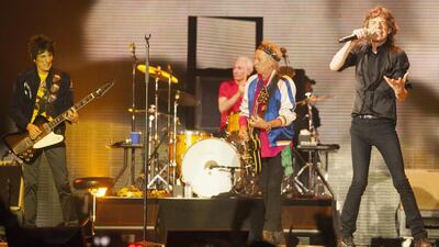 Ronnie Wood, Charlie Watts, Keith Richards and Mick Jagger of British band The Rolling Stones perform at a sold out concert in Macau, China, 09 March 2014. Alex Hofford / AFP