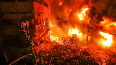 Flames tearing through several buildings in an old part of Bangladesh's capital Dhaka last Wednesday. Zabed Hasnain Chowdhury / AP