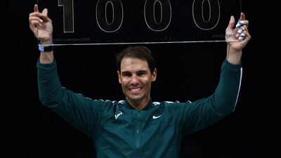 Spain's Rafael Nadal poses with the trophy marking his 1,000th victory. AFP