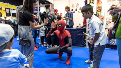 Spider-Man mingles with some children. Antonie Robertson / The National