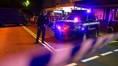 Police stand on a street that has been blocked to the public after Australian counter-terrorism police arrested four people in raids late on Saturday across several Sydney suburbs in Australia. David Gray / Reuters