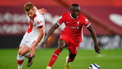 Liverpool's Sadio Mane under pressure from Stuart Armstrong of Southampton. EPA
