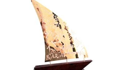 The Trip of the Sail, stainless steel with 24K gold plating set on wooden base from an old, traditional ship. Courtesy Jamal Al Suwaidi