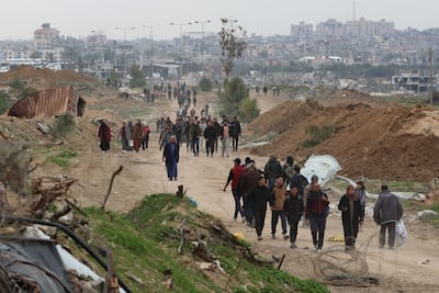 Displaced Palestinians cross the Netzarim Corridor to northern Gaza. AFP